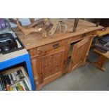 A continental pine cupboard fitted two drawers