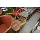 An Ercol stick back rocking chair