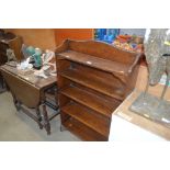 An oak open fronted bookcase