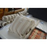 Three striped upholstered cushions and matching f