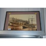 A framed and glazed photographic print