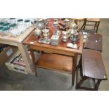 A mahogany two tier and tiled topped table