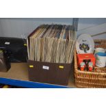 A box of various vinyl records