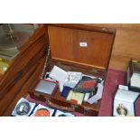 A wooden box and contents of various jewellery to