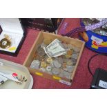 A box containing various coinage