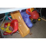 A childs toy car; rocking horse; swing and slide