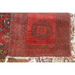A small Eastern mat, having stylised decoration on