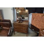 An oak dressing chest fitted three drawers