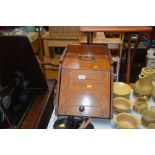 A golden oak coal scuttle