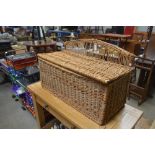 A wicker basket with lid
