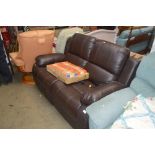 A brown leather upholstered two seater reclining s