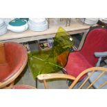 A green perspex chair