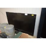 A Sharp flat screen television without remote cont