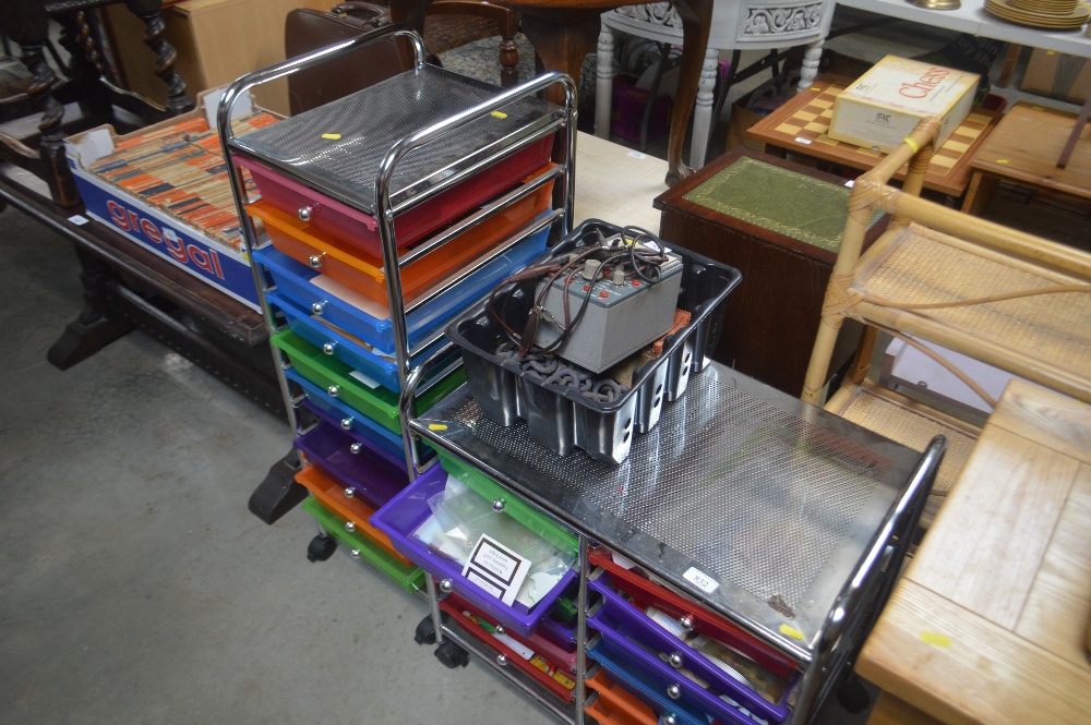Two multi-drawer metal and plastic chests and cont