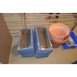 Two pairs of blue painted planters and three plast