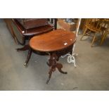 A Victorian style mahogany oval top table