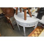 A grey painted demi-lune hall table