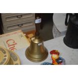 A brass bell (88)
