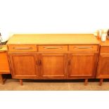 A British teak sideboard, of G plan design, fitted