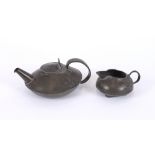 A Liberty & Co. pewter teapot and milk jug, No.023