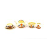 A Clarice Cliff "Crocus" pattern part tea set, com