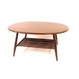 A dark Ercol oval coffee table with magazine under