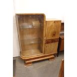 An Art Deco walnut display cabinet, fitted glass a