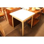 A vintage Formica topped draw leaf dining table
