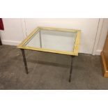 A brass square shaped occasional table, having pla