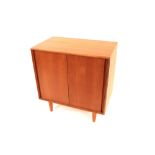 A pair of G-plan teak side cabinets enclosed by sl