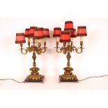 A pair of Rococo design five light table lamps, raised on