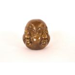 A bronzed four face Buddha head