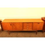 A 1970's G plan sideboard, fitted four short drawe