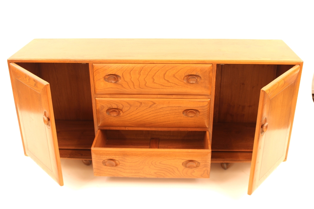 A blonde Ercol sideboard, fitted three central dra - Image 2 of 2