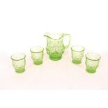 A green glass lemonade set
