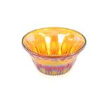 A large amber glass punch bowl, with raised fruit