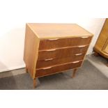 A Danish teak chest, of four long drawers, raised