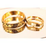 A yellow metal and niello ware snap bangle; and a