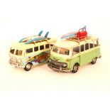 A pair of model Volkswagen camper vans