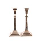 A pair of mid 20th Century silver candlesticks, ra