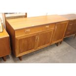 A British teak sideboard, fitted single drawer abo