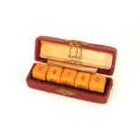 A Dunhill Butterscotch poker dice set