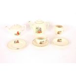 An Art Deco child's tea set, decorated with Nurser