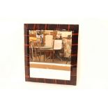 An Art Deco design wall mirror, having faux coroma