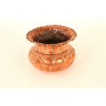 A copper fern pot, possibly Dr Christopher Dresser