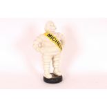 A cast iron Michelin man, 37cm high