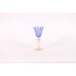A Venetian glass goblet, the bowl with blue strip