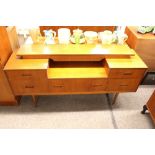 A teak G-plan low sideboard fitted various drawers