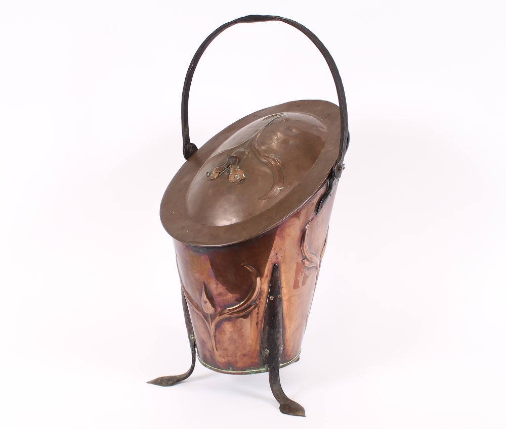 An Art Nouveau design copper coal scuttle, having