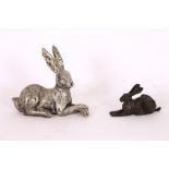A small bronze figure of a recumbent hare; and a c
